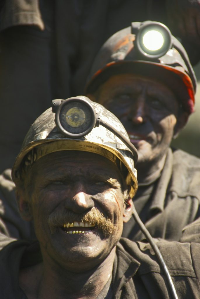 Two dirty coal miners in the Boglands of Ireland